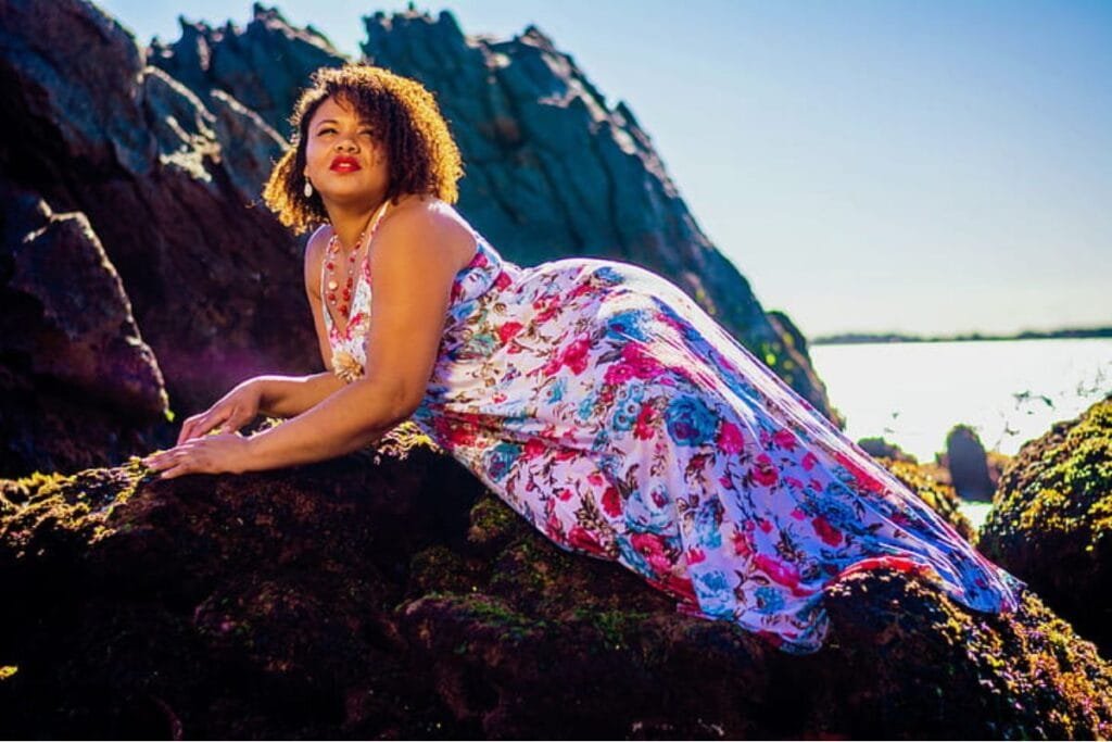 A woman in a floral multicolored dress