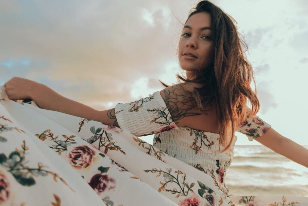 A woman looking stunning in a long floral dress