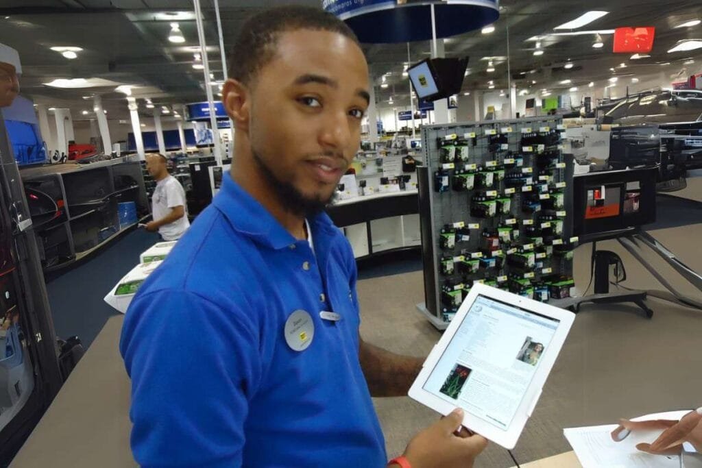 salesperson at best buy giving demo of Apple I pad
