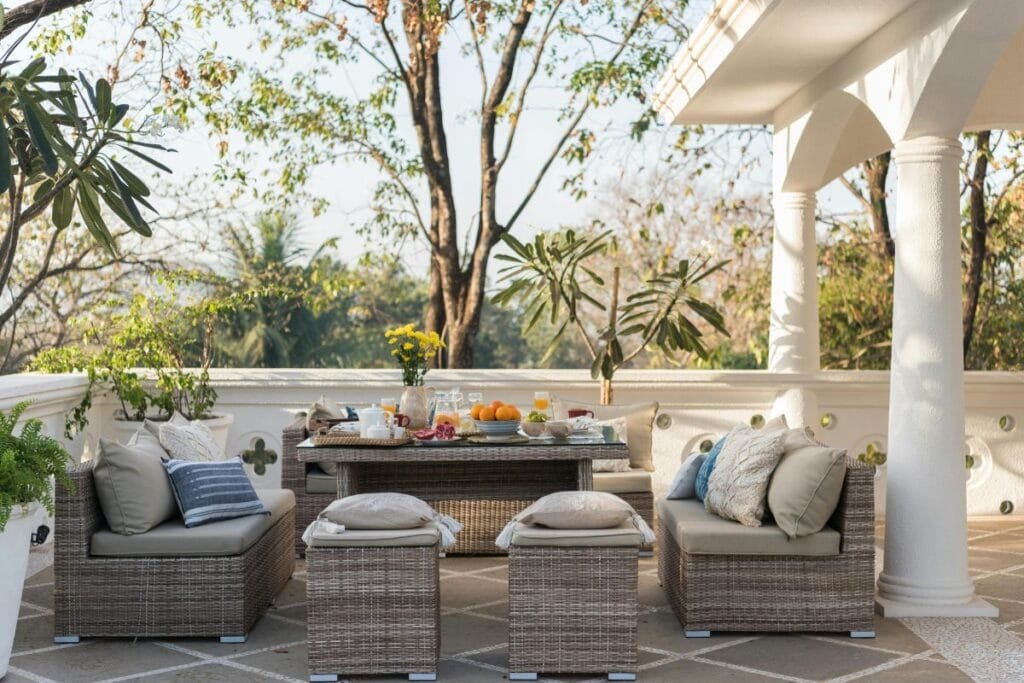 A cute patio furniture setup is placed outdoors