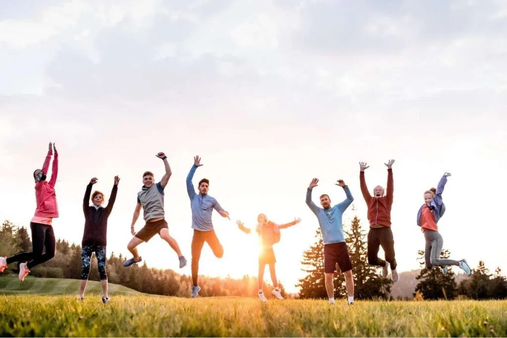 group of people in fitness wear and running shoes