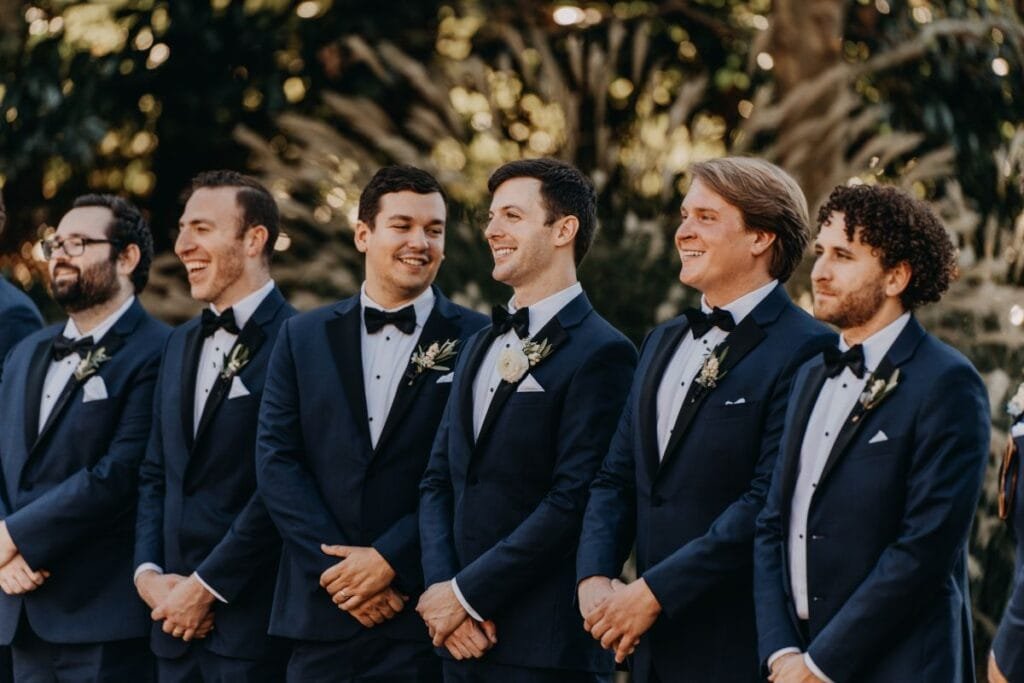 A group of men wearing tuxedos for a wedding