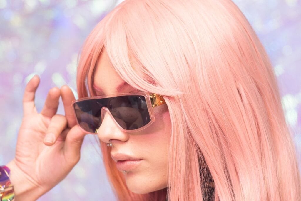 A woman in hair wig and sunglasses from wish